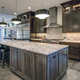 Kitchen with oversized kitchen island with seating and workspace and cabinets